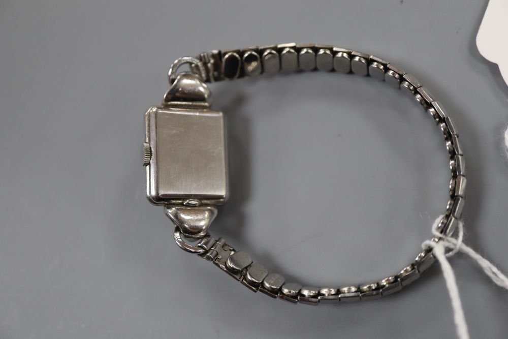 A ladys stainless steel Omega manual wind wrist watch, on associated bracelet.